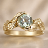 Green amethyst engagement ring with leaves band