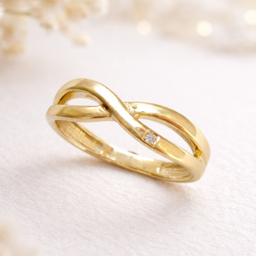 14k yellow gold infinity know band 2026 minimalist style with single diamond pave side