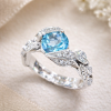 Swiss blue topaz floral nature inspired engagement ring in 14k white gold with accent diamonds by Benati