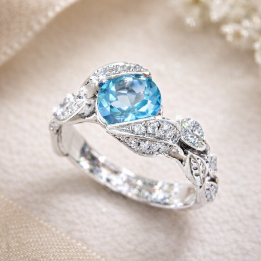 Swiss blue topaz floral nature inspired engagement ring in 14k white gold with accent diamonds by Benati