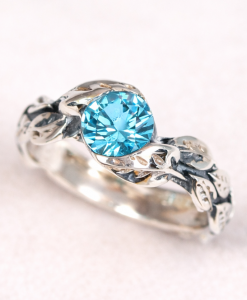 Silver leaf ring with oxidized details and blue topaz, nature inspired silver ring, vine leaf engagement ring, blue topaz ring for women, botanical silver ring, handmade leaf band with gemstone, dainty blue topaz ring, organic vine ring silver, unique engagement ring blue stone, artisan silver leaf ring, vintage style blue topaz ring, delicate stacking ring silver, women’s nature inspired jewelry