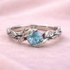 Silver leaf ring with oxidized details and blue topaz, nature inspired silver ring, vine leaf engagement ring, blue topaz ring for women, botanical silver ring, handmade leaf band with gemstone, dainty blue topaz ring, organic vine ring silver, unique engagement ring blue stone, artisan silver leaf ring, vintage style blue topaz ring, delicate stacking ring silver, women’s nature inspired jewelry