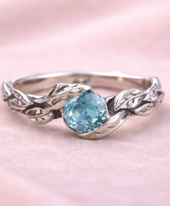 Silver leaf ring with oxidized details and blue topaz, nature inspired silver ring, vine leaf engagement ring, blue topaz ring for women, botanical silver ring, handmade leaf band with gemstone, dainty blue topaz ring, organic vine ring silver, unique engagement ring blue stone, artisan silver leaf ring, vintage style blue topaz ring, delicate stacking ring silver, women’s nature inspired jewelry