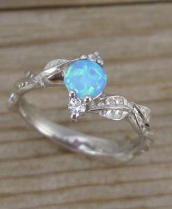 Nature inspired opal engagement ring with leaves