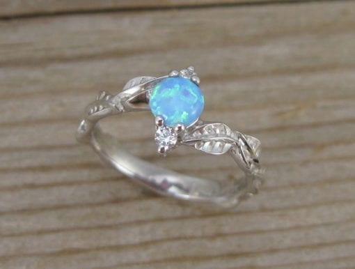 Nature inspired opal engagement ring with leaves