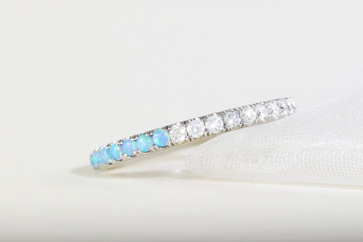 Half diamond half opal eternity ring