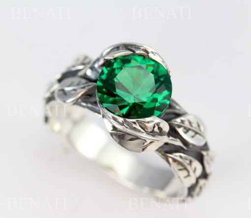 Draw a platinum ring with three diamonds and one emerald on Craiyon