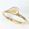 Wave ring in 14k yellow gold and small diamond accent