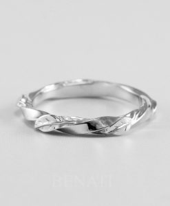 Twisted wedding band with nature inspired leaves in 14k white gold