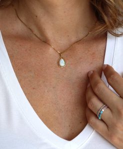 Pear opal pendant with Greek pattern in 14k yellow gold
