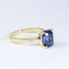 2.3 Carat Lab Sapphire Engagement Ring: 14k Gold Mobius Band, Diamond Accents 2.3 Carat Lab Sapphire Engagement Ring: 14k Gold Mobius Band, Diamond Accents