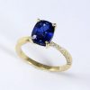 2.3 Carat Lab Sapphire Engagement Ring: 14k Gold Mobius Band, Diamond Accents Elongated cushion lab sapphire ring with accent diamonds