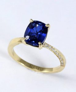 Elongated cushion lab sapphire ring with accent diamonds
