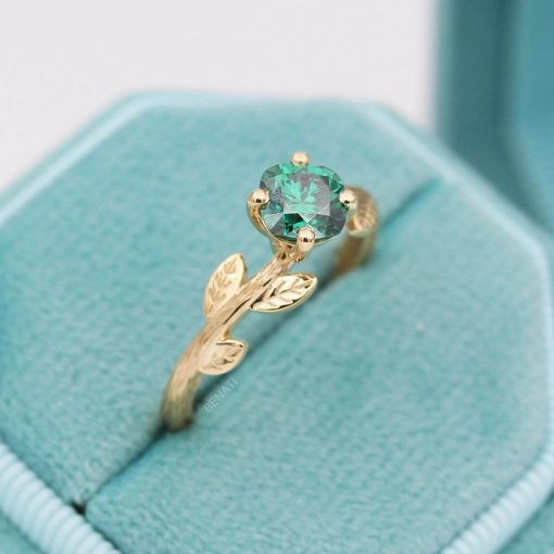 Green moissanite cushion cut ring with nature inspired theme in 14k yellow gold
